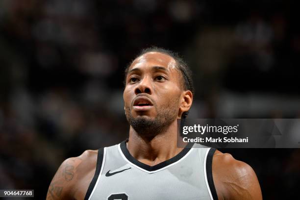 Kawhi Leonard of the San Antonio Spurs looks on during the game against the Denver Nuggets on January 13, 2018 at the AT&T Center in San Antonio,...