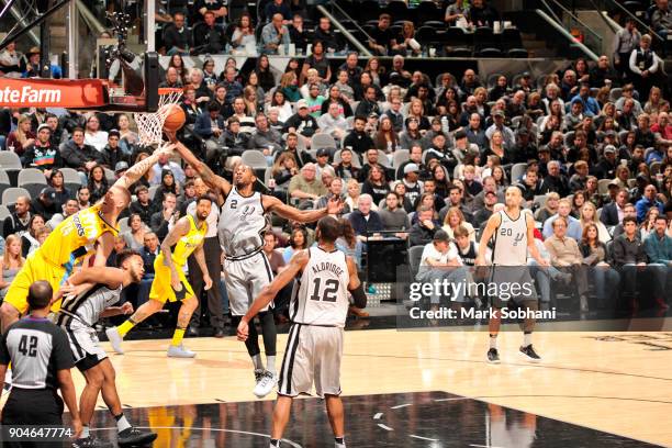 Kawhi Leonard of the San Antonio Spurs gets the rebound against the Denver Nuggets on January 13, 2018 at the AT&T Center in San Antonio, Texas. NOTE...