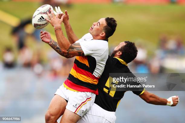 Zac Guilford of Waikato collects the ball over Leon Ellison of Wellington during the Bayleys National Sevens semi final cup match between Waikato and...