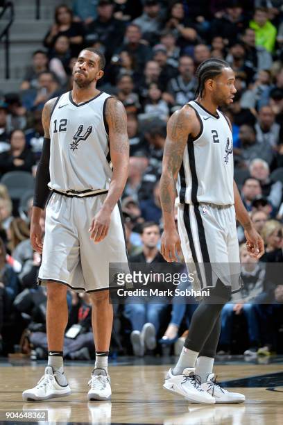 Kawhi Leonard of the San Antonio Spurs and LaMarcus Aldridge of the San Antonio Spurs look on during the game against the Denver Nuggets on January...
