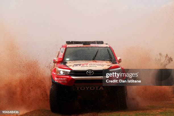 Giniel De Villiers of South Africa and Toyota Gazoo Racing drives with co-driver Dirk Von Zitzewitz of Germany in the Hilux Toyota car in the Classe...