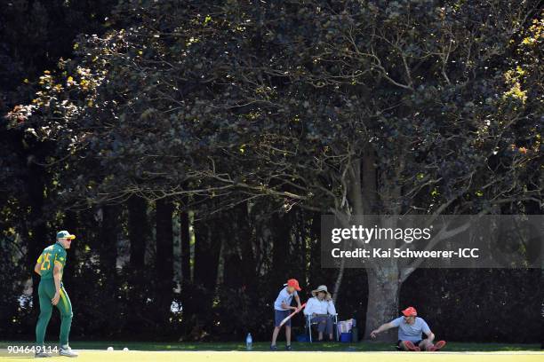 Spectators play backyard cricket during the ICC U19 Cricket World Cup match between South Africa and Kenya at Lincoln Green on January 14, 2018 in...