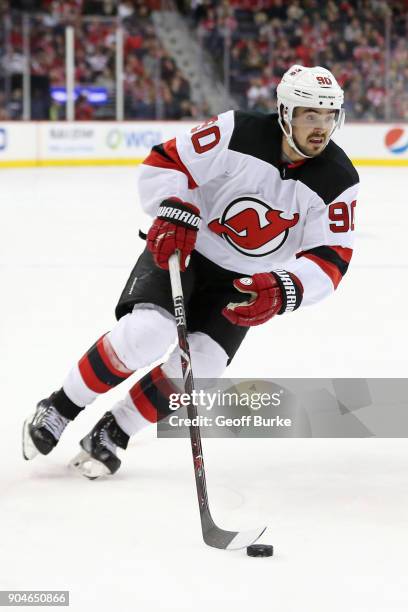 Marcus Johansson of the New Jersey Devils skates with the puck against the Washington Capitals at Capital One Arena on December 30, 2017 in...