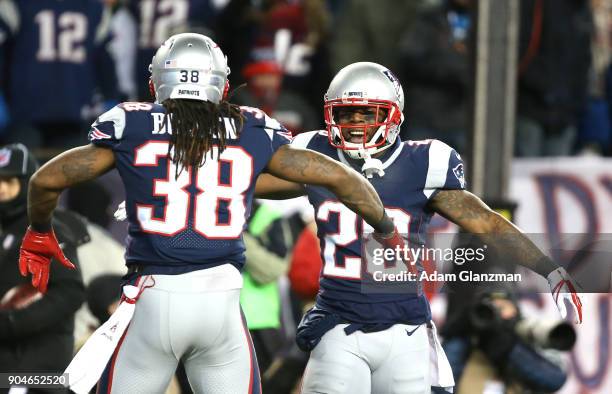 Brandon Bolden of the New England Patriots reacts with James White after scoring a touchdown in the third quarter of the AFC Divisional Playoff game...