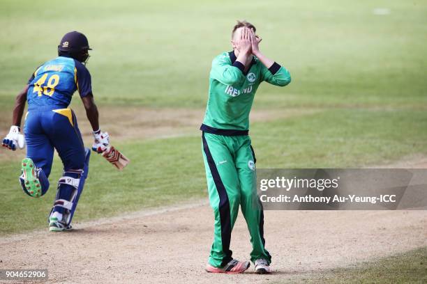 Harry Tector of Ireland reacts as Kamindu Mendis of Sri Lanka makes his run during the ICC U19 Cricket World Cup match between Sri Lanka and Ireland...