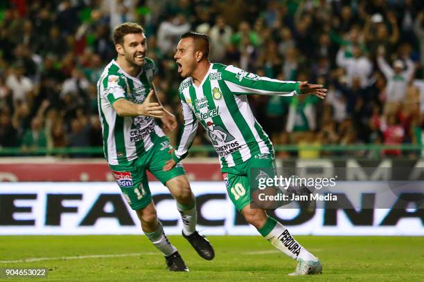 Luis Montes of Leon celebrates with teammate Mauro Boselli after scoring the second goal of his team during the second round match between Leon and...