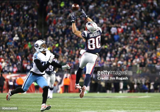 Danny Amendola of the New England Patriots catches a pass as he is defended by Logan Ryan of the Tennessee Titans during the fourth quarter in the...