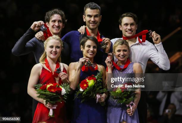 Gold medalists Meagan Duhamel and Eric Radford, center, pose for a picture with silver medalists Julianne Seguin and Charlie Bilodeau, left, and...