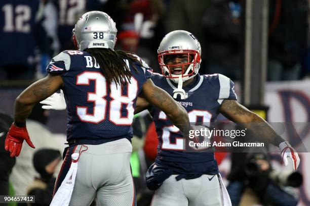 Brandon Bolden of the New England Patriots reacts with James White after scoring a touchdown in the third quarter of the AFC Divisional Playoff game...