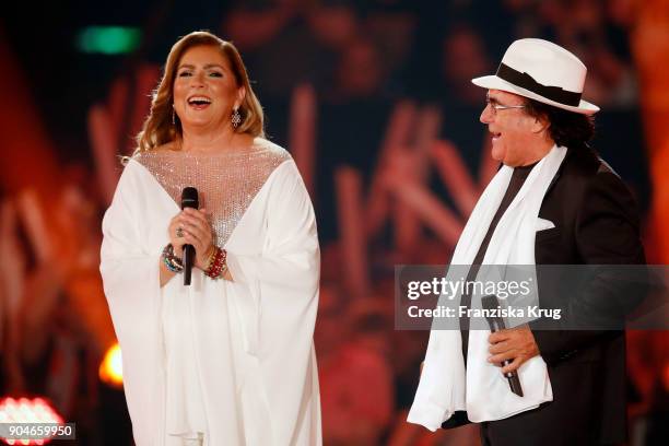 Al Bano & Romina Power perform during the 'Schlagerchampions - Das grosse Fest der Besten' TV Show at Velodrom on January 13, 2018 in Berlin, Germany.