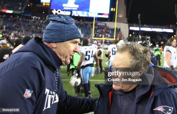 Head cocah Bill Belichick of the New England Patriots shakes hands with head coach Mike Mularkey of the Tennessee Titans after winning the AFC...