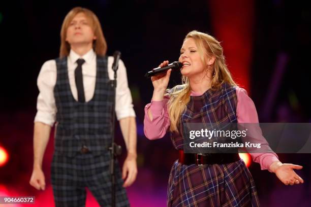 John Michael Kelly and Maria Patricia Kelly perform during the 'Schlagerchampions - Das grosse Fest der Besten' TV Show at Velodrom on January 13,...