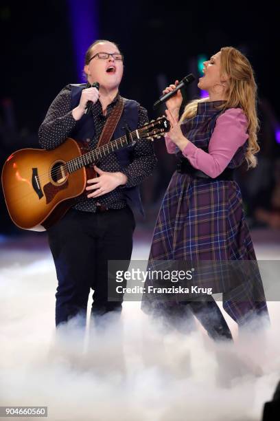 Angelo Kelly and Maria Patricia Kelly perform during the 'Schlagerchampions - Das grosse Fest der Besten' TV Show at Velodrom on January 13, 2018 in...