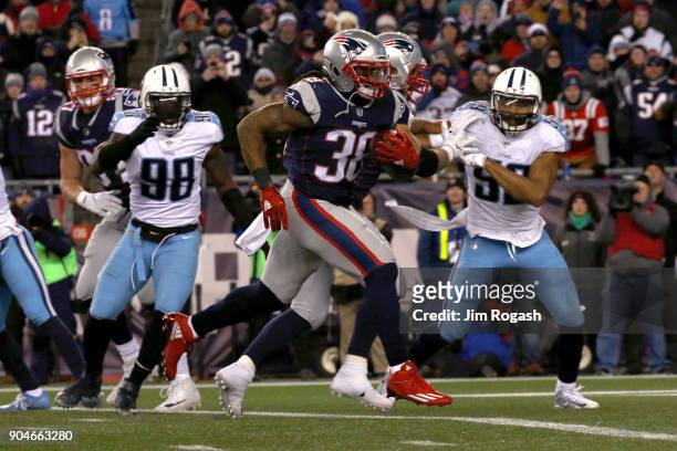 Brandon Bolden of the New England Patriots carries the ball during the third quarter in the AFC Divisional Playoff game against the Tennessee Titans...
