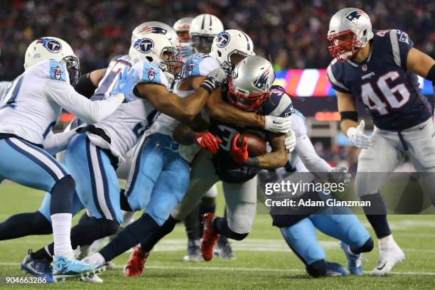 Brandon Bolden of the New England Patriots carries the ball during the third quarter in the AFC Divisional Playoff game against the Tennessee Titans...