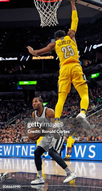 Kawhi Leonard of the San Antonio Spurs waits for Malik Beasley of the Denver Nuggets to fly by before he shoots at AT&T Center on January 13, 2018 in...