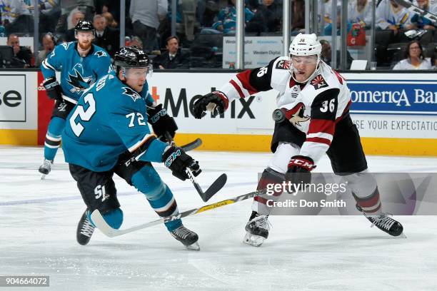 Tim Heed of the San Jose Sharks skates against Christian Fischer of the Arizona Coyotes at SAP Center on January 13, 2018 in San Jose, California.