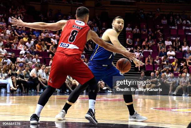 Adam Gibson of the Bullets looks to pass during the round 14 NBL match between the Brisbane Bullets and the Perth Glory at Brisbane Convention &...