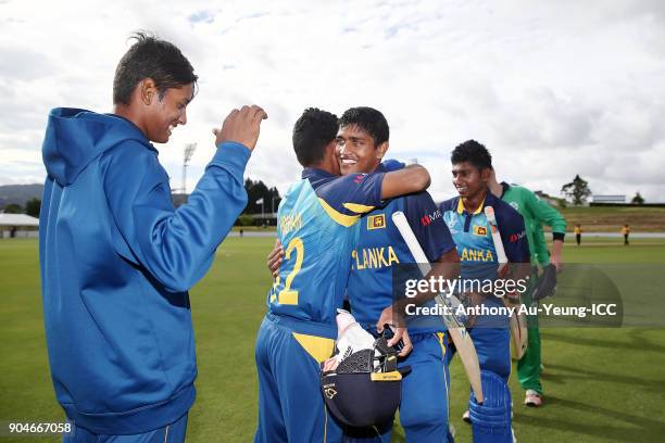 Dhananjaya Lakshan of Sri Lanka is congratulated with his Man of the Match performance after winning the ICC U19 Cricket World Cup match between Sri...