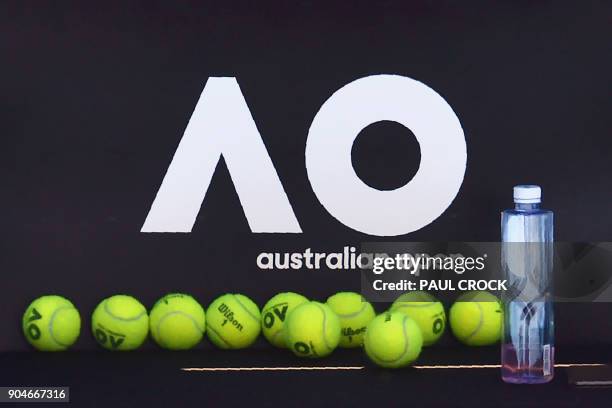 Official tennis balls for the Australian Open are seen on a chair during a practice session ahead of the Australian Open tennis tournament in...