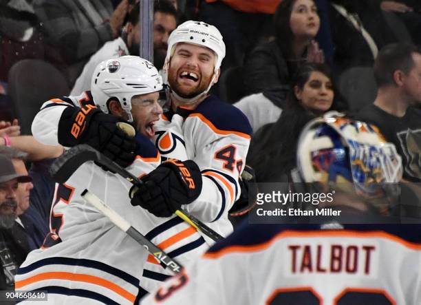Darnell Nurse and Zack Kassian of the Edmonton Oilers celebrate after Nurse scored an overtime goal against the Vegas Golden Knights to win their...