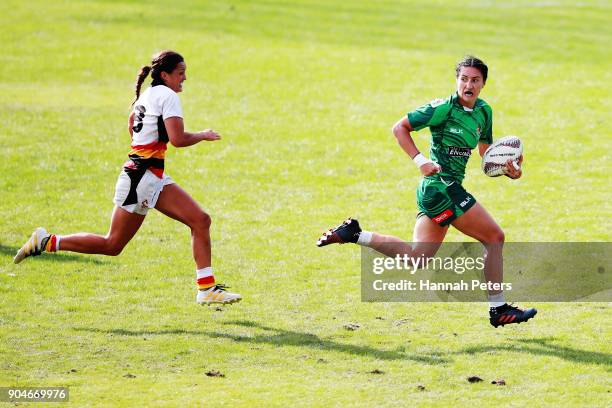 Sarah Goss of Manawatu makes a break during the Bayleys National Sevens Women's Cup Final match between Manawatu and Waikato at Rotorua International...