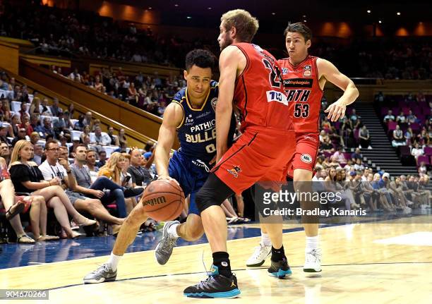 Travis Trice of the Bullets takes on the defence during the round 14 NBL match between the Brisbane Bullets and the Perth Wildcats at Brisbane...