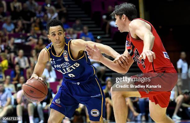 Travis Trice of the Bullets takes on the defence during the round 14 NBL match between the Brisbane Bullets and the Perth Wildcats at Brisbane...