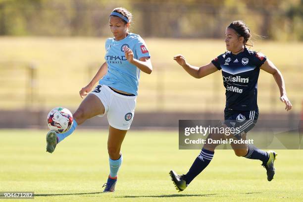 Ashley Hatch of Melbourne City and Angela Beard of Melbourne Victory contest the ball during the round 11 W-League match between the Melbourne...