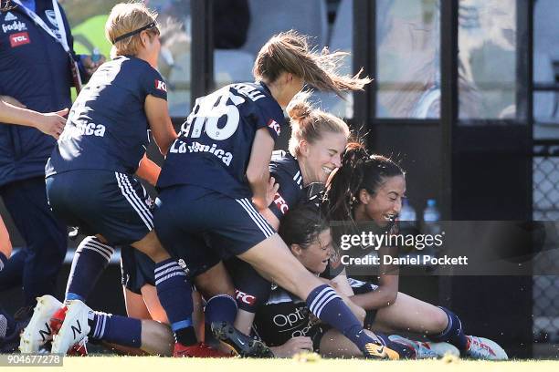 Melbourne Victory celebrate a goal to Melina Ayres of Melbourne Victory during the round 11 W-League match between the Melbourne Victory and...