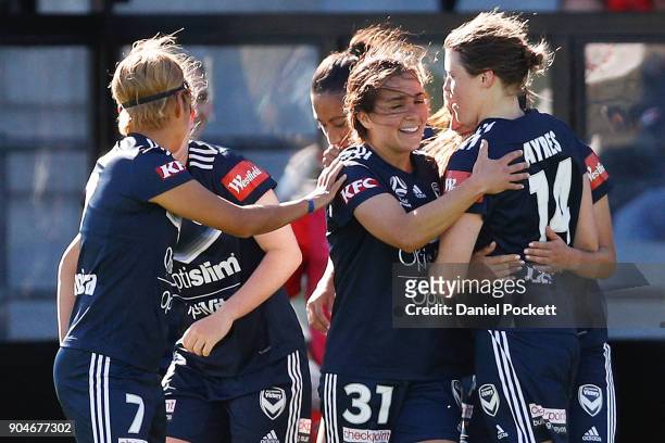 Melbourne Victory celebrate a goal to Melina Ayres of Melbourne Victory during the round 11 W-League match between the Melbourne Victory and...