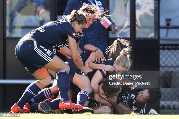 Melbourne Victory celebrate a goal to Melina Ayres of Melbourne Victory during the round 11 W-League match between the Melbourne Victory and...