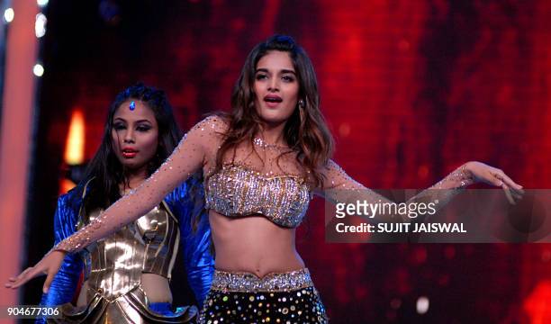 Indian Bollywood actress Nidhhi Agerwal takes part in the'Umang Mumbai Police Show 2018' in Mumbai on late January 13, 2018. / AFP PHOTO / Sujit...