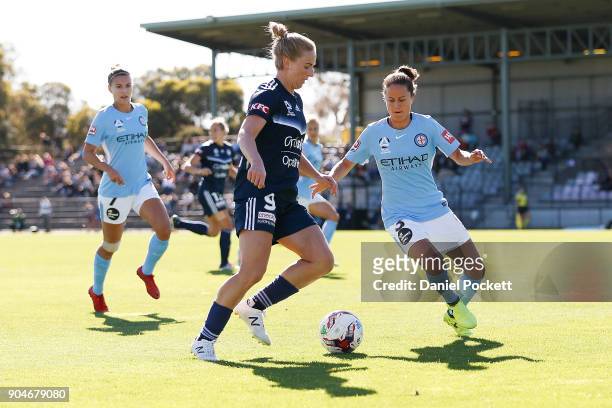 Natasha Dowie of Melbourne Victory and Lauren Barnes of Melbourne City contest the ball during the round 11 W-League match between the Melbourne...