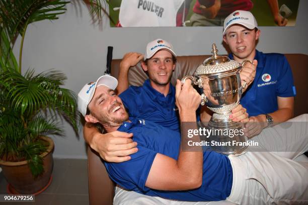 Tommy Fleetwood, Thomas Pieters and Matthew Fitzpatrick of Europe celebrate with the trophy following their team's victory during the singles matches...