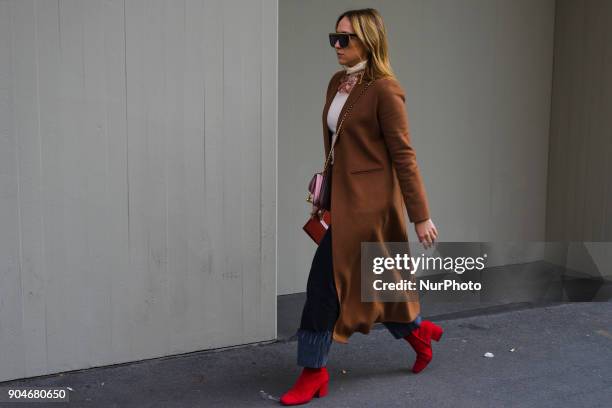 Guest is seen on the set of the Dolce &amp; Gabbana Advertising Campaign street style during Milan Men's Fashion Week Fall/Winter 2018/19 on January...