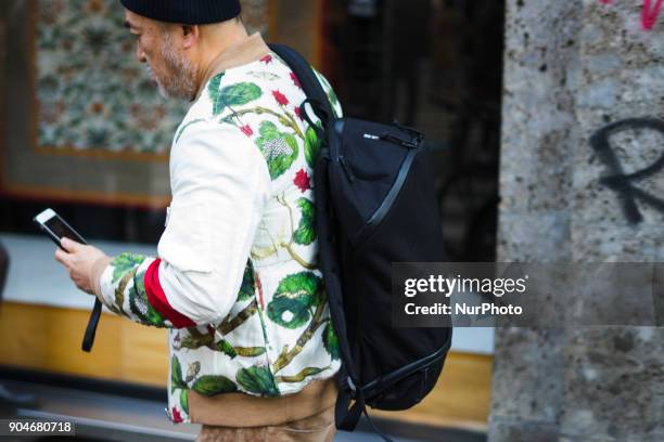 Guest is seen on the set of the Dolce &amp; Gabbana Advertising Campaign street style during Milan Men's Fashion Week Fall/Winter 2018/19 on January...