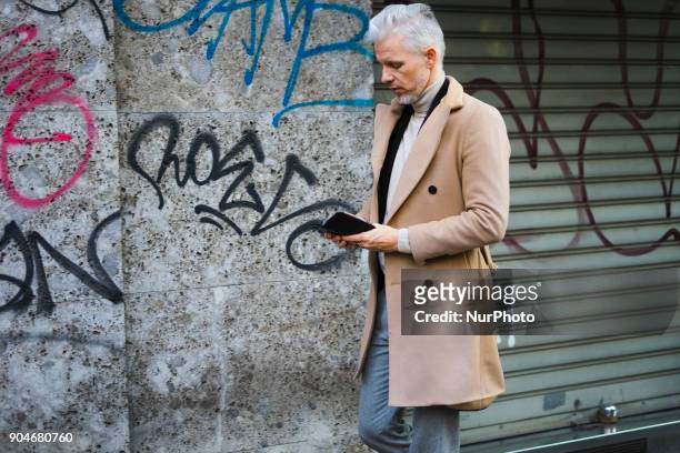 Guest is seen on the set of the Dolce &amp; Gabbana Advertising Campaign street style during Milan Men's Fashion Week Fall/Winter 2018/19 on January...