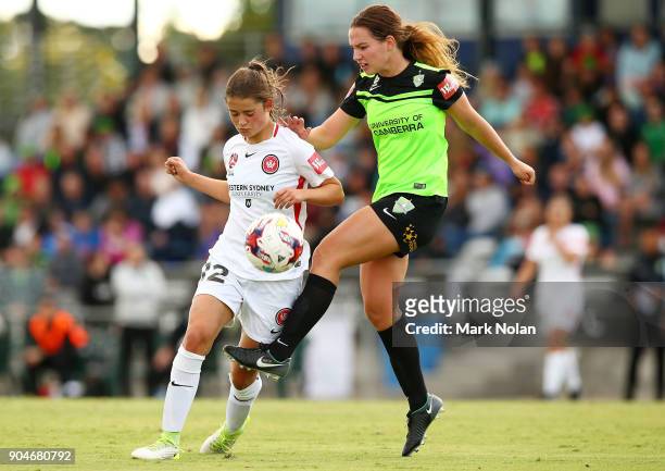 Rachel Lowe of the Wanderers and Grace Maher of Canberra contest possession during the round 11 W-League match between Canberra United and the...