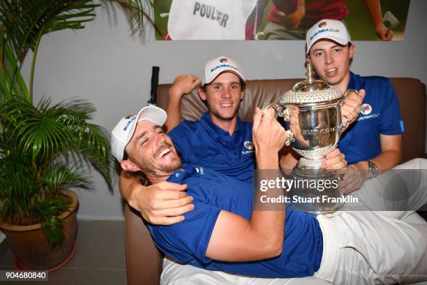 Tommy Fleetwood, Thomas Pieters and Matthew Fitzpatrick of Europe celebrate with the trophy following their team's victory during the singles matches...