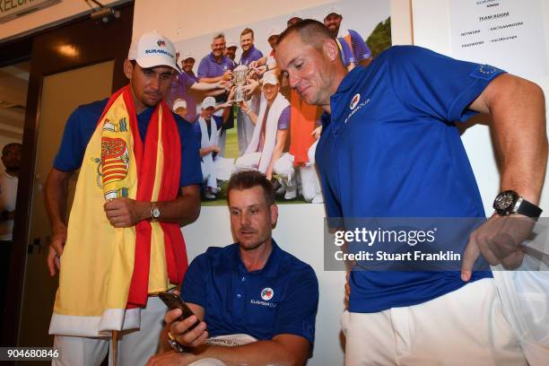 Rafa Cabrera-Bello, Henrik Stenson and Alex Noren of Europe look on following their team's victory during the singles matches on day three of the...