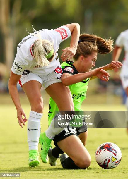 Erica Halloway of the Wanderers and Aoife Colvill of Canberra contest possession during the round 11 W-League match between Canberra United and the...