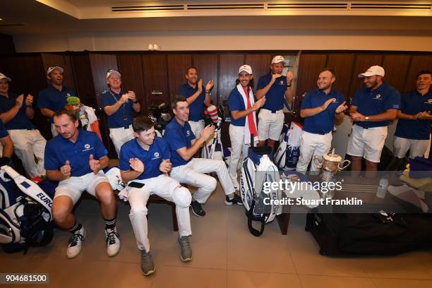 The team Europe players celebrate in the locker room following their victory during the singles matches on day three of the 2018 EurAsia Cup...