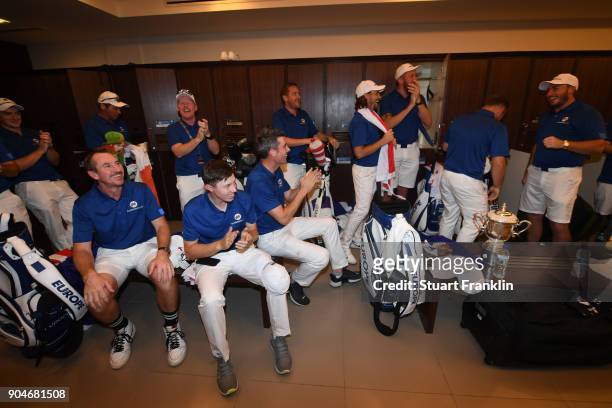 The team Europe players celebrate in the locker room following their victory during the singles matches on day three of the 2018 EurAsia Cup...
