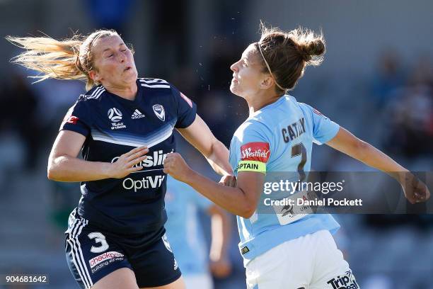 Alexandra Gummer of Melbourne Victory and Stephanie Catley of Melbourne City collide during the round 11 W-League match between the Melbourne Victory...