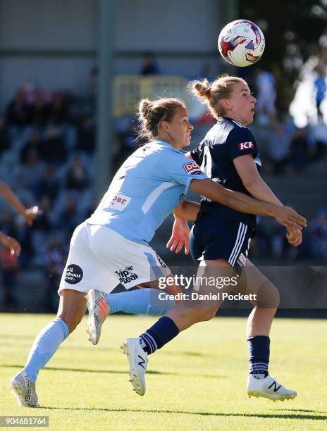 Natasha Dowie of Melbourne Victory and Aivi Luik of Melbourne City contest the ball during the round 11 W-League match between the Melbourne Victory...