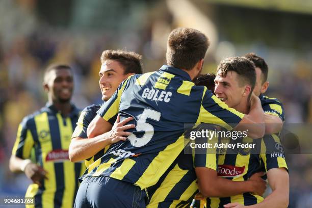 Mariners team mates celebrate a goal from Jake McGing of the Mariners during the round 16 A-League match between the Central Coast Mariners and...