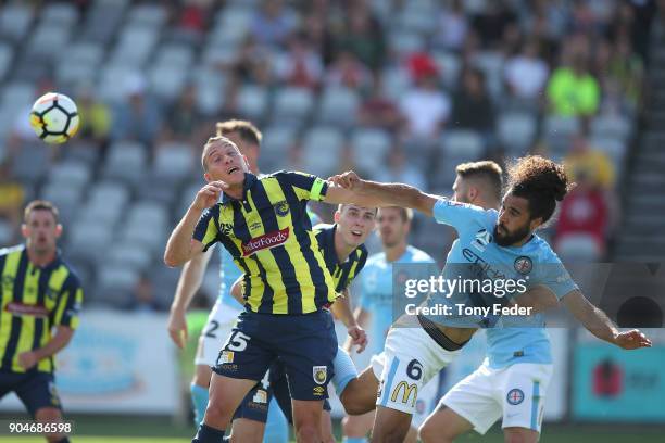 Alan Baro of the Mariners contests a header with Osama Malik of City during the round 16 A-League match between the Central Coast Mariners and...