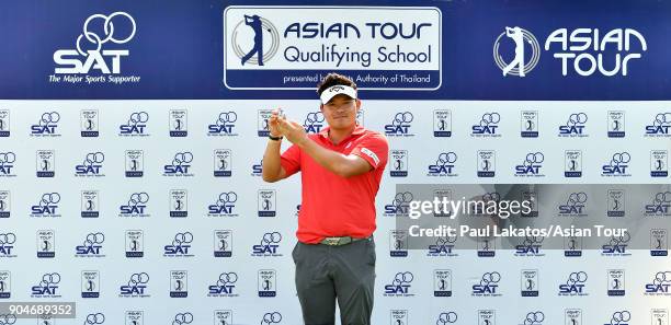 Seungtaek Lee of Korea pictured with the Asian Tour's player's clip securing his 2018 playing rights during round five of the 2018 Asian Tour...