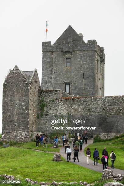 tourists at dunguaire castle in county galway, ireland - kinvara stock pictures, royalty-free photos & images